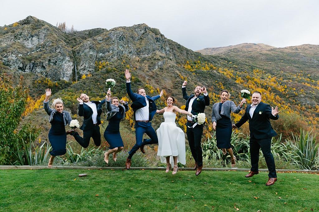 Wedding party jump in the air