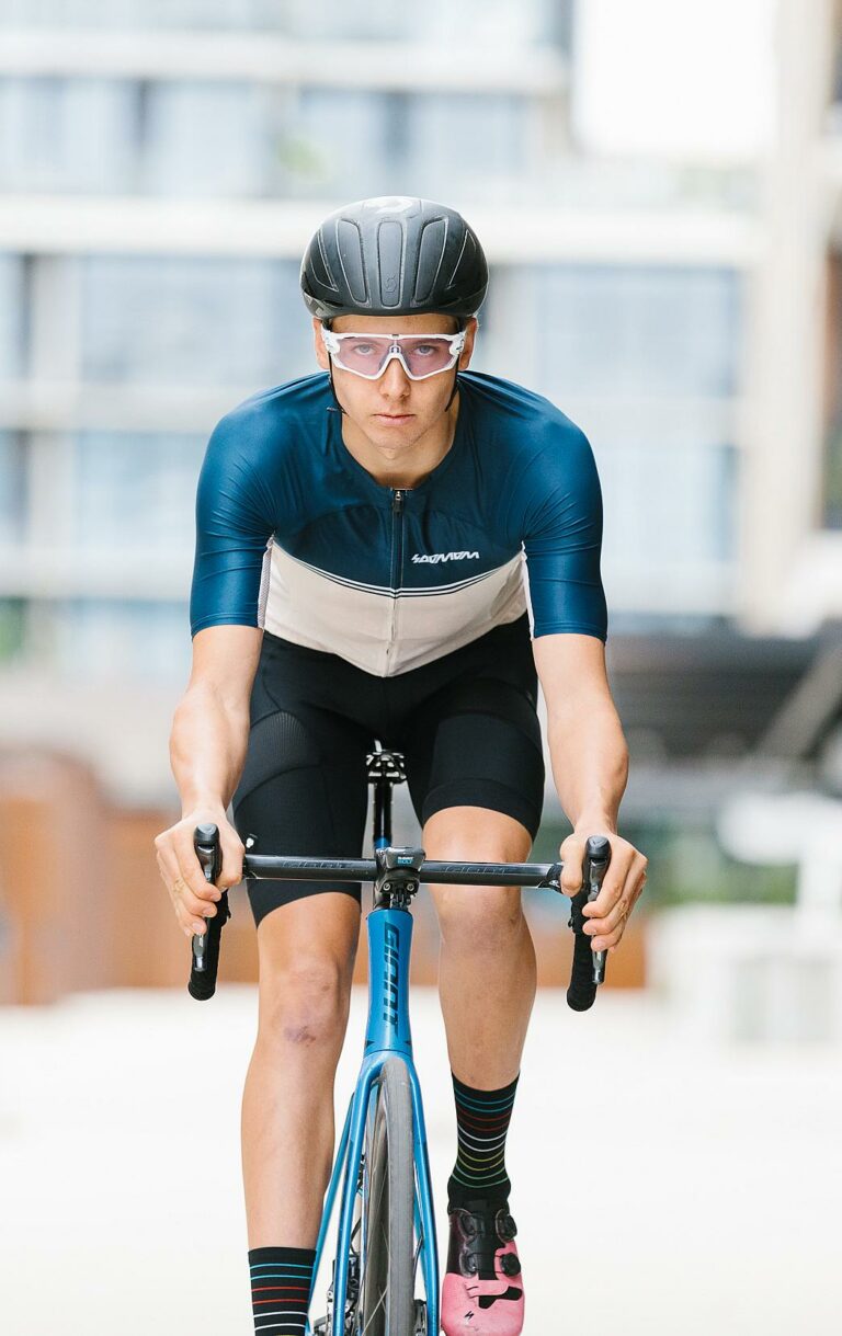 Man cycling towards camera