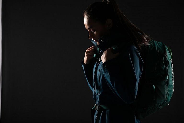 Dramatic photo of girl wearing backpack